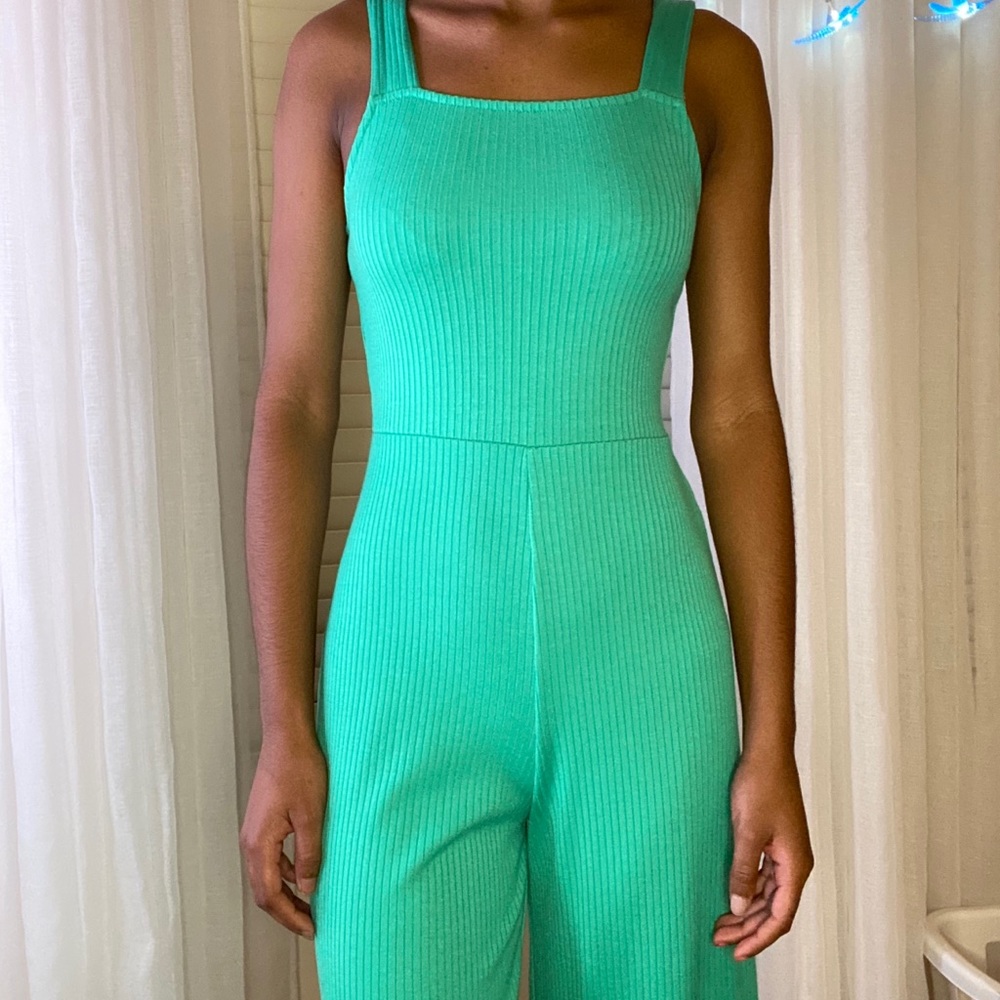 green bell bottomed jumpsuit